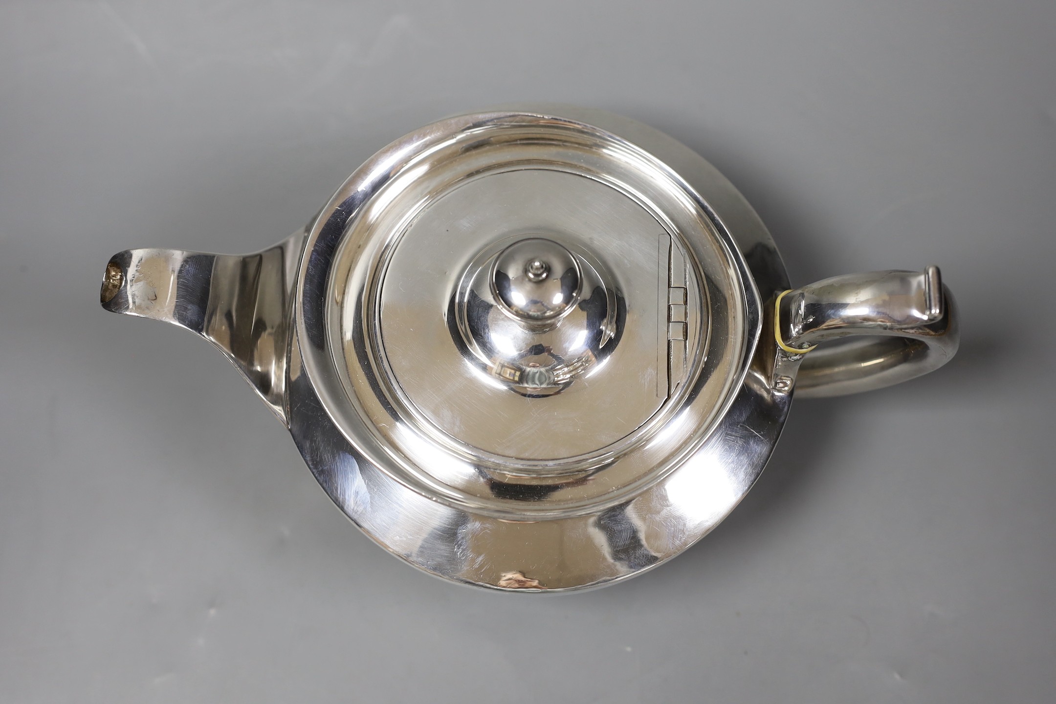 A George III squat circular silver teapot, by William Burwash, London 1820, gross 22oz.